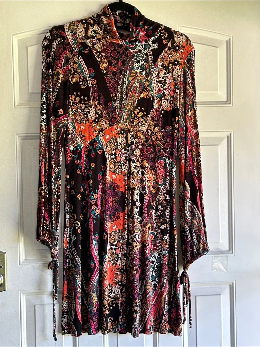 FREE PEOPLE “ALL DOLLED UP “ MINI DRESS WITH A TURTLENECK AND KEYHOLE BACK SZ S